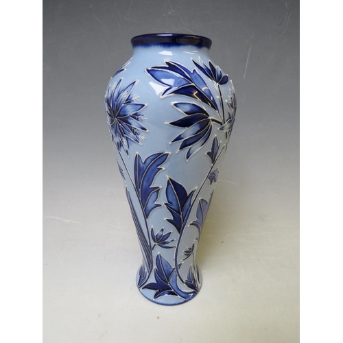 347 - A MOORCROFT POTTERY FLORIAN VASE, with tubelined floral sprays on contrasting blue ground, marks and... 