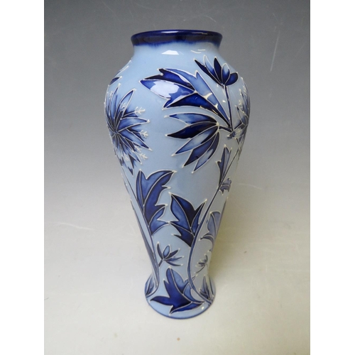 347 - A MOORCROFT POTTERY FLORIAN VASE, with tubelined floral sprays on contrasting blue ground, marks and... 