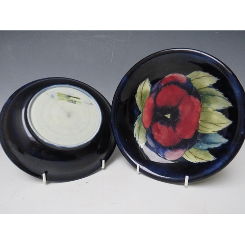 351 - A PAIR OF MOORCROFT PANSY PATTERN DISHES, with tubelined decoration, impressed marks and signed with... 