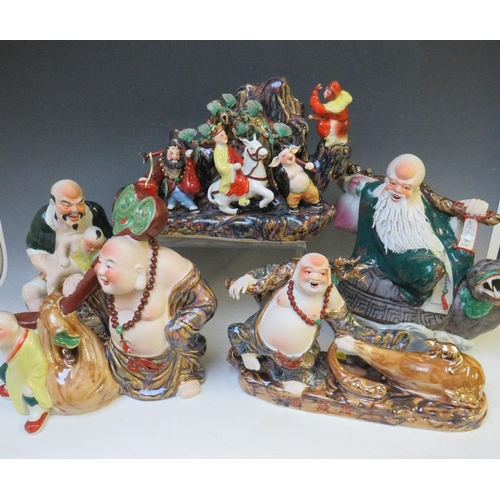 370 - A COLLECTION OF FIVE ASSORTED LARGE ORIENTAL PORCELAIN FIGURES, each dressed in traditional dress, i... 