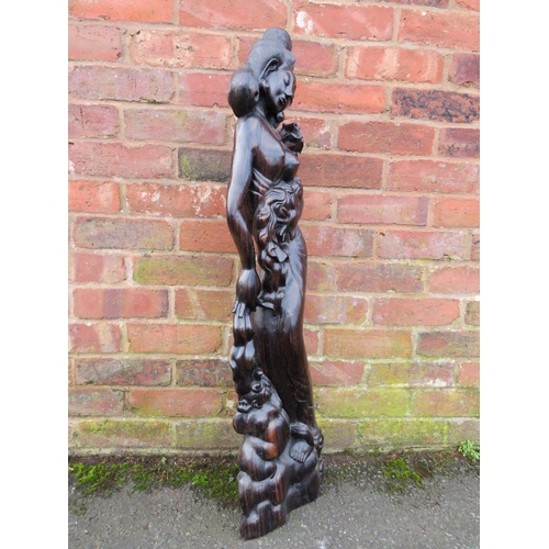 372 - AN UNUSUAL EASTERN HARDWOOD CARVED FIGURE, depicting a semi-clad girl with a baby and a further figu... 