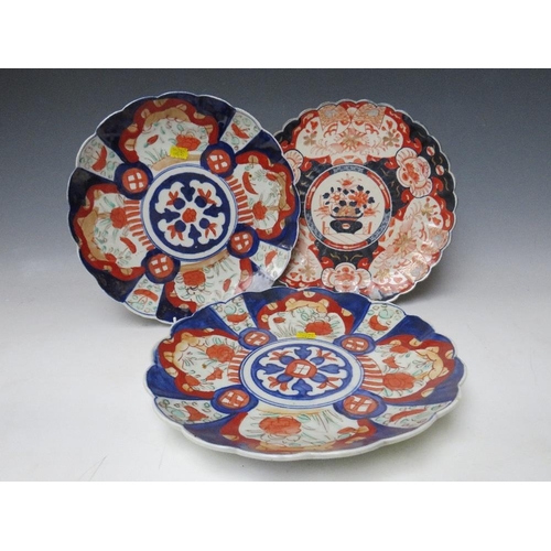 374 - A PAIR OF JAPANESE IMARI PATTERN CHARGERS, together with another, Dia. 30 cm (3)