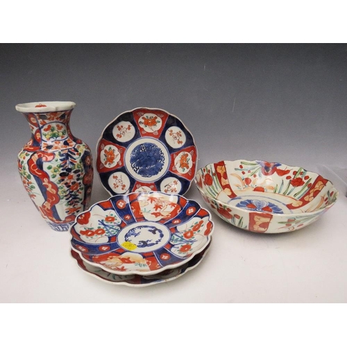 375 - THREE JAPANESE IMARI PATTERN PLATES, Dia. 21 cm, together with a bowl - Dia. 25 cm, and a vase - H 2... 