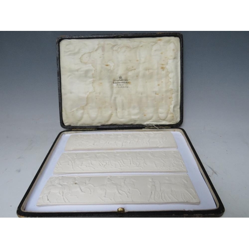 381 - THREE GRAND TOUR STYLE PLAQUES, depicting classical friezes of horsemen, in leather bound case, each... 