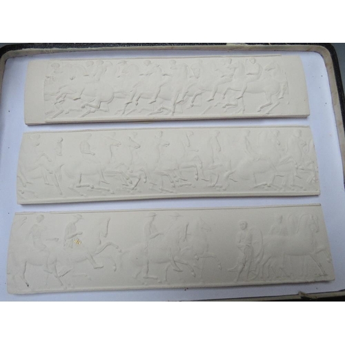 381 - THREE GRAND TOUR STYLE PLAQUES, depicting classical friezes of horsemen, in leather bound case, each... 