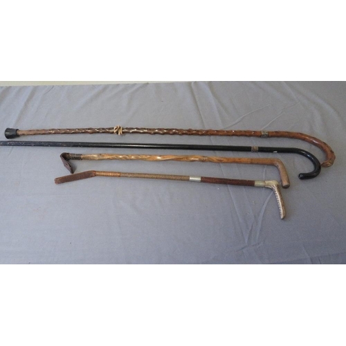 385 - TWO VINTAGE SILVER MOUNTED WALKING STICKS, average L 85 cm, together with two vintage riding crops, ... 