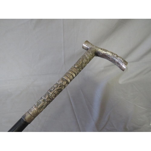 390 - A LATE 19TH / EARLY 20TH CENTURY WALKING STICK, with white metal ornate handle, L 81 cm