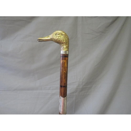 391 - A LATE 19TH / EARLY 20TH CENTURY WALKING STICK, with white metal banding and white metal handle in t... 