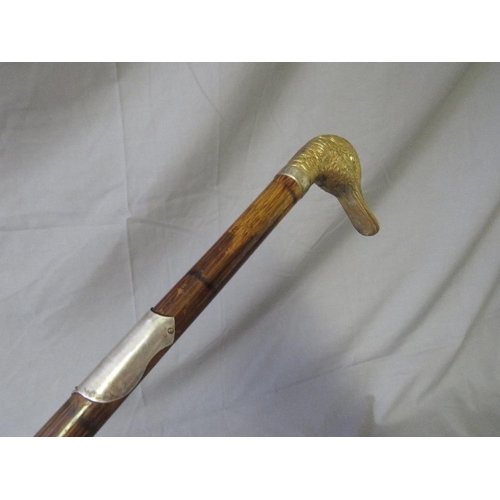 391 - A LATE 19TH / EARLY 20TH CENTURY WALKING STICK, with white metal banding and white metal handle in t... 