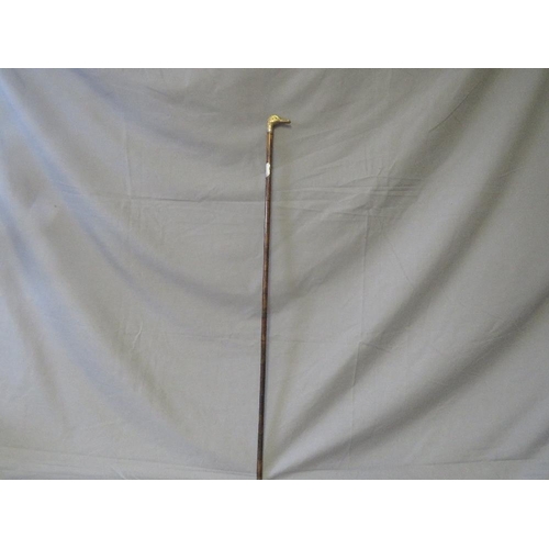 391 - A LATE 19TH / EARLY 20TH CENTURY WALKING STICK, with white metal banding and white metal handle in t... 