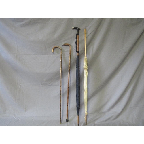 394 - TWO 19TH CENTURY PARASOLS, together with two late 19th / early 20th century walking sticks, some wit... 