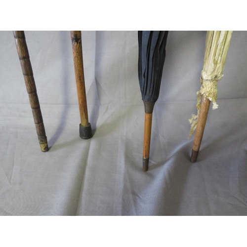 394 - TWO 19TH CENTURY PARASOLS, together with two late 19th / early 20th century walking sticks, some wit... 