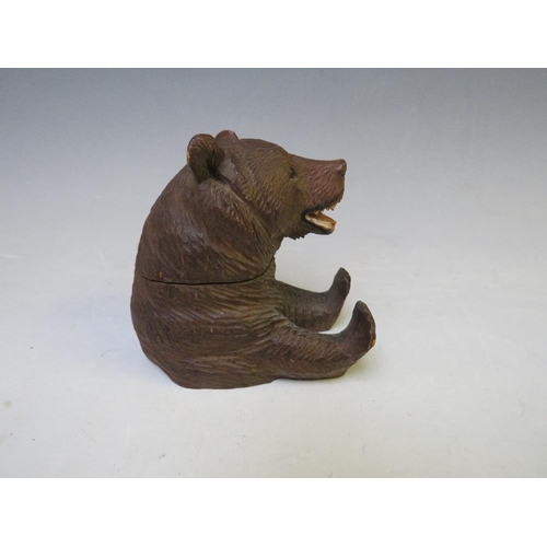 403 - A BLACK FOREST SEATED BEAR INKWELL, the head hinging to reveal a glass inkwell, H 8.5 cm