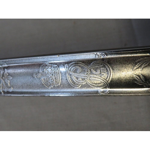 410 - AN EDWARD VII INFANTRY OFFICERS SWORD, with solid hilt with ER VII cypher, the blade engraved with s... 