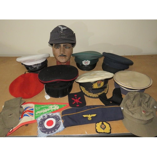 428 - A COLLECTION OF VARIOUS MILITARY CAPS AND BERETS ETC., to include Naval and German types, along with... 