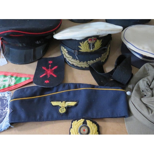 428 - A COLLECTION OF VARIOUS MILITARY CAPS AND BERETS ETC., to include Naval and German types, along with... 