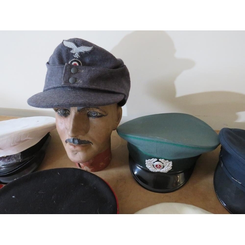 428 - A COLLECTION OF VARIOUS MILITARY CAPS AND BERETS ETC., to include Naval and German types, along with... 