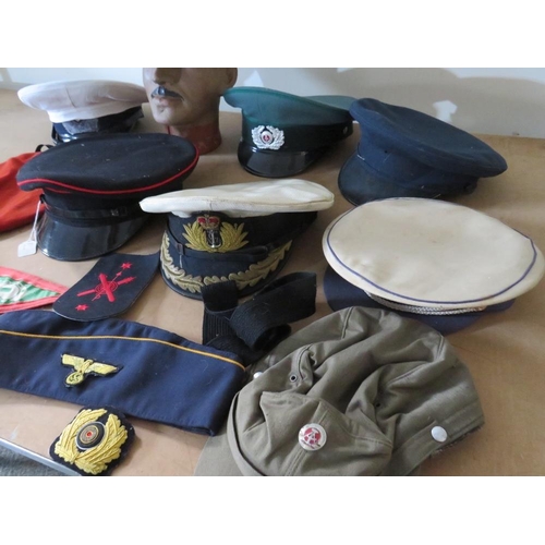 428 - A COLLECTION OF VARIOUS MILITARY CAPS AND BERETS ETC., to include Naval and German types, along with... 