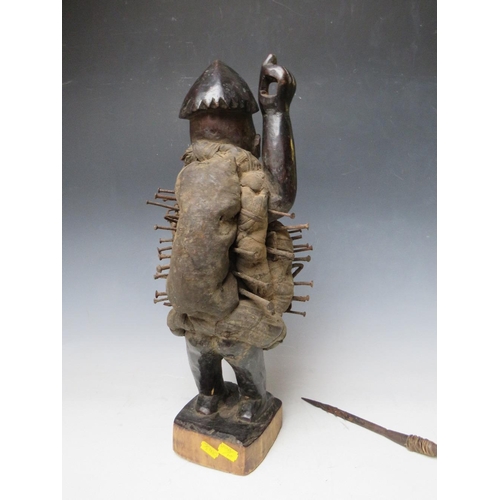 434 - A KONGO POWER FIGURE BRANDISHING AN IRON SPEAR WITH INSET GLASS EYES AND A PANEL TO HIS ABDOMEN, H 4... 