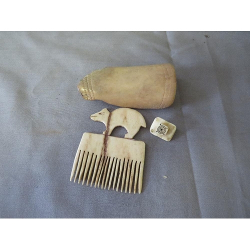 441 - A 19TH CENTURY NORTH AMERICAN INUIT CARVED WRIST GUARD, Arctic fox comb and parka toggle