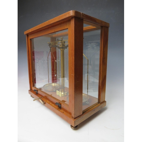 456 - A SET OF PHILIP HARRIS OF BIRMINGHAM BALANCE SCALES, in glazed mahogany case