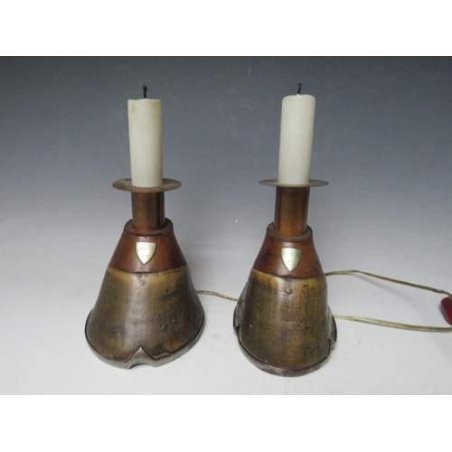 459 - A PAIR OF HORSE HOOF CANDLE STICKS, converted to table lamps, each with an attached shield inscribed... 