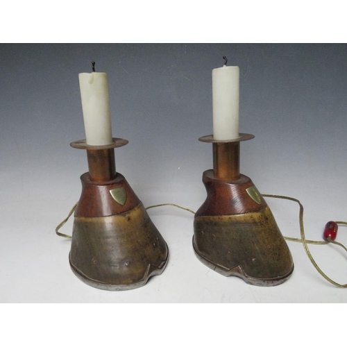 459 - A PAIR OF HORSE HOOF CANDLE STICKS, converted to table lamps, each with an attached shield inscribed... 