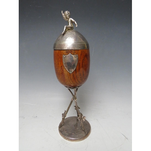 467 - A VICTORIAN OAK AND SILVER PLATED CUP AND COVER, on a plated stand, H 28 cm