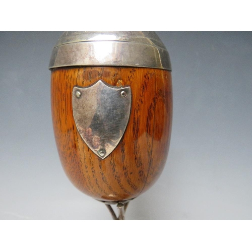 467 - A VICTORIAN OAK AND SILVER PLATED CUP AND COVER, on a plated stand, H 28 cm