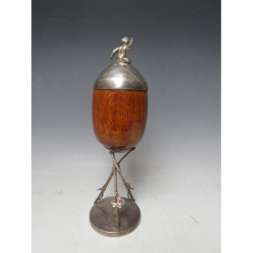 467 - A VICTORIAN OAK AND SILVER PLATED CUP AND COVER, on a plated stand, H 28 cm