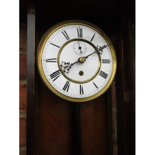 476 - A SLIM CASED 8 DAY VIENNA REGULATOR WALL CLOCK, the mahogany case having ebonised columns, the singl... 