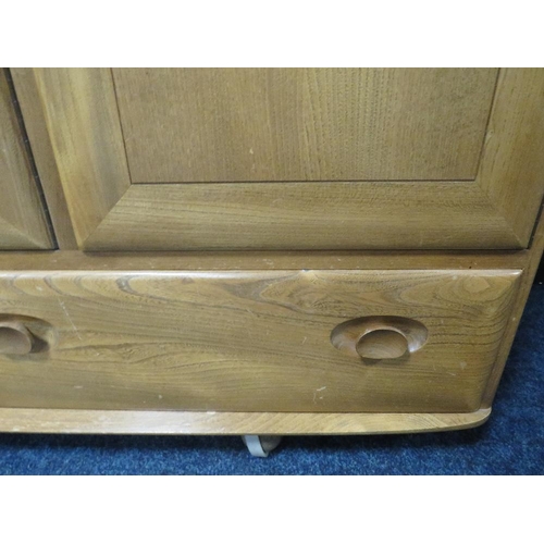 493 - AN ERCOL LIGHT ELM SIDEBOARD, with two drawers, on castors, W 130 cm