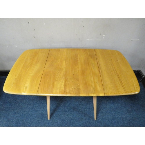 495 - AN ERCOL LIGHT ELM DROPLEAF TABLE, together with two hoop back chairs