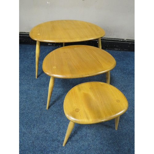 496 - AN ERCOL LIGHT ELM 'PEBBLES'  NEST OF THREE TABLES