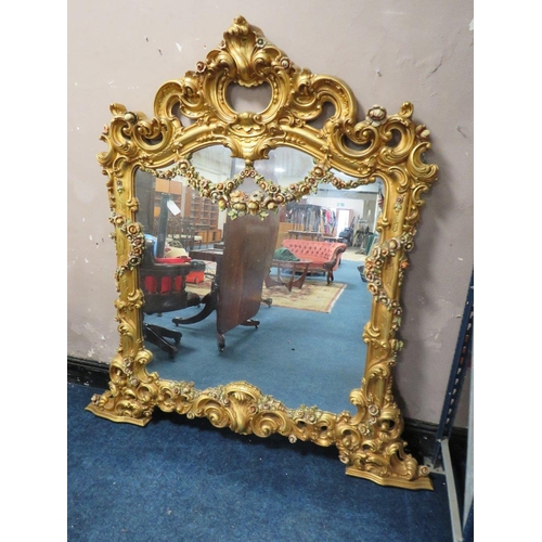 497 - A LARGE MODERN GILT COMPOSITE OVERMANTLE MIRROR, with Rococo and floral scrolling, 172 x 170 cm