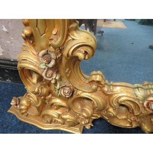 497 - A LARGE MODERN GILT COMPOSITE OVERMANTLE MIRROR, with Rococo and floral scrolling, 172 x 170 cm