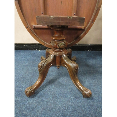 500 - A VICTORIAN WALNUT TILT-TOP LOO TABLE, the quarter veneered top having original snap lock mechanism,... 