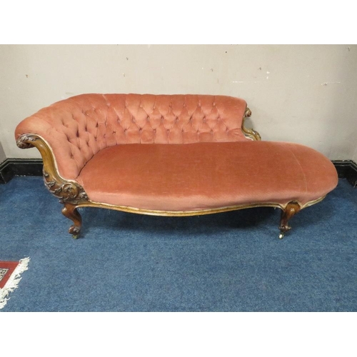 501 - A VICTORIAN WALNUT UPHOLSTERED SHAPED SETTEE