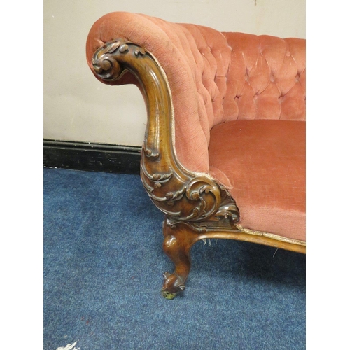 501 - A VICTORIAN WALNUT UPHOLSTERED SHAPED SETTEE