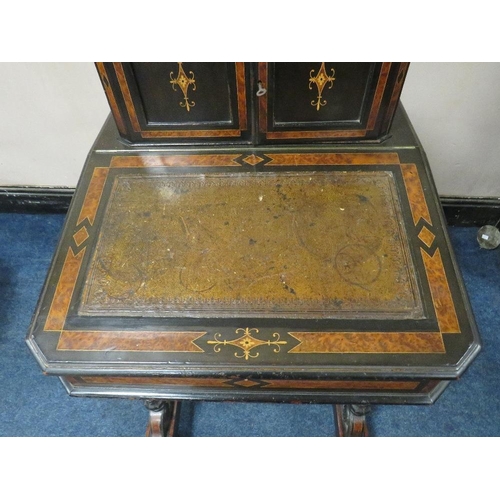 503 - A 19TH CENTURY EBONISED AND WALNUT DAVENPORT, the twin door upper section opening to drawers and pig... 