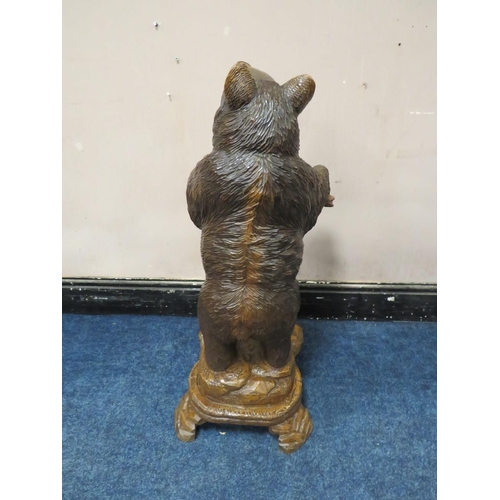 504 - A BLACK FOREST STYLE CARVED STANDING BEAR STICK STAND, with arms outstretched, H 89 cm