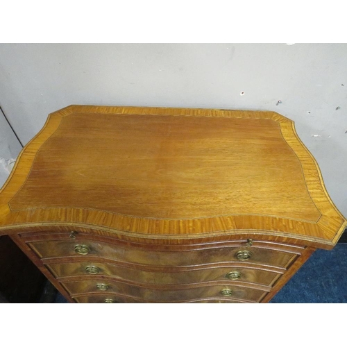 505 - A REPRODUCTION MAHOGANY CROSSBANDED SERPENTINE CHEST OF FIVE GRADUATED DRAWERS, with brushing slide,... 