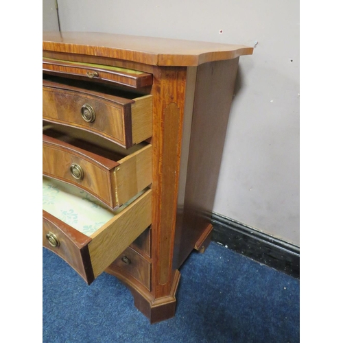 505 - A REPRODUCTION MAHOGANY CROSSBANDED SERPENTINE CHEST OF FIVE GRADUATED DRAWERS, with brushing slide,... 