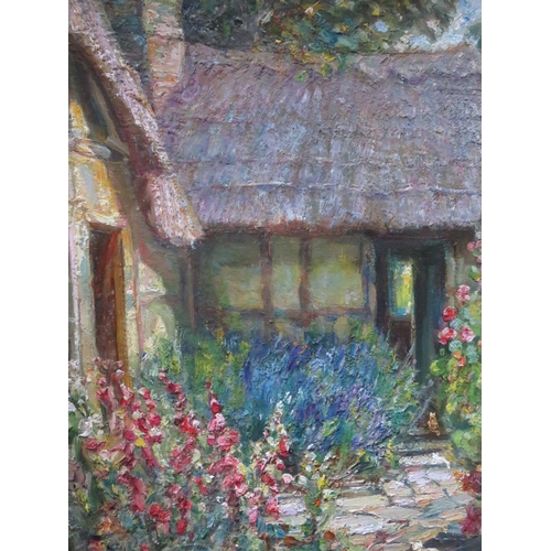 88 - JAMES TOWNSHEND (d.1949). A 20th century impressionist thatched cottage courtyard scene with cat 'We... 