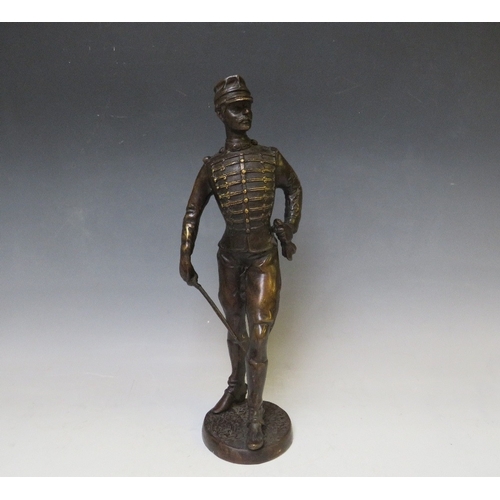 282 - A LATE 19TH / EARLY 20TH CENTURY BRONZE FIGURE STUDY OF A FRENCH ARMY OFFICER WITH SWORD, raised on ... 