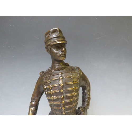 282 - A LATE 19TH / EARLY 20TH CENTURY BRONZE FIGURE STUDY OF A FRENCH ARMY OFFICER WITH SWORD, raised on ... 