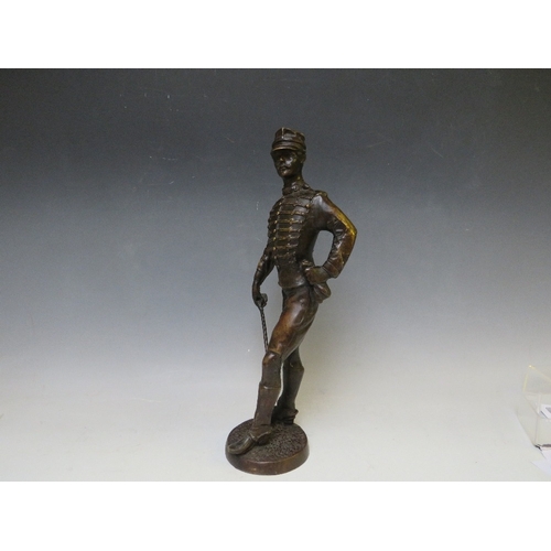 282 - A LATE 19TH / EARLY 20TH CENTURY BRONZE FIGURE STUDY OF A FRENCH ARMY OFFICER WITH SWORD, raised on ... 