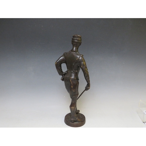 282 - A LATE 19TH / EARLY 20TH CENTURY BRONZE FIGURE STUDY OF A FRENCH ARMY OFFICER WITH SWORD, raised on ... 