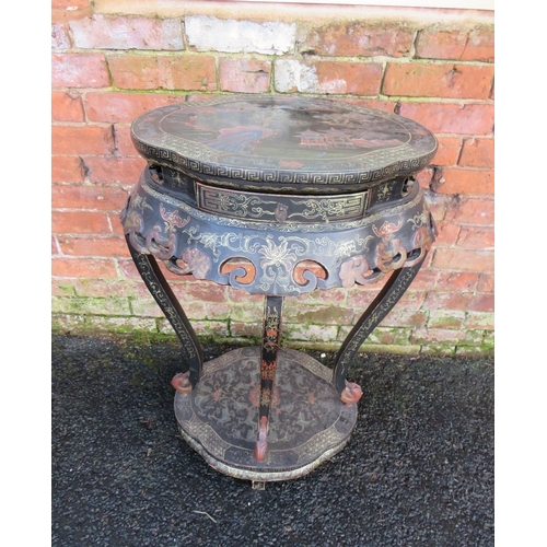 507 - AN ORIENTAL EBONISED TWO TIER JARDINIERE STAND, decorated in typical style with gilt and coloured de... 