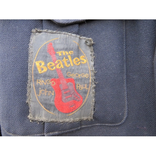 115 - A VINTAGE BLACK 'BEATLES' BLAZER / JACKET, with numerous vintage badges and patches